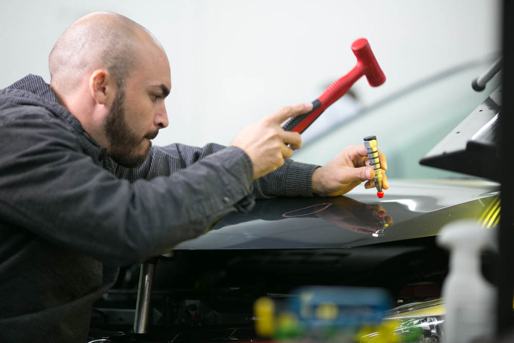 Learning PDR Professional paintless dent removal training with Myke